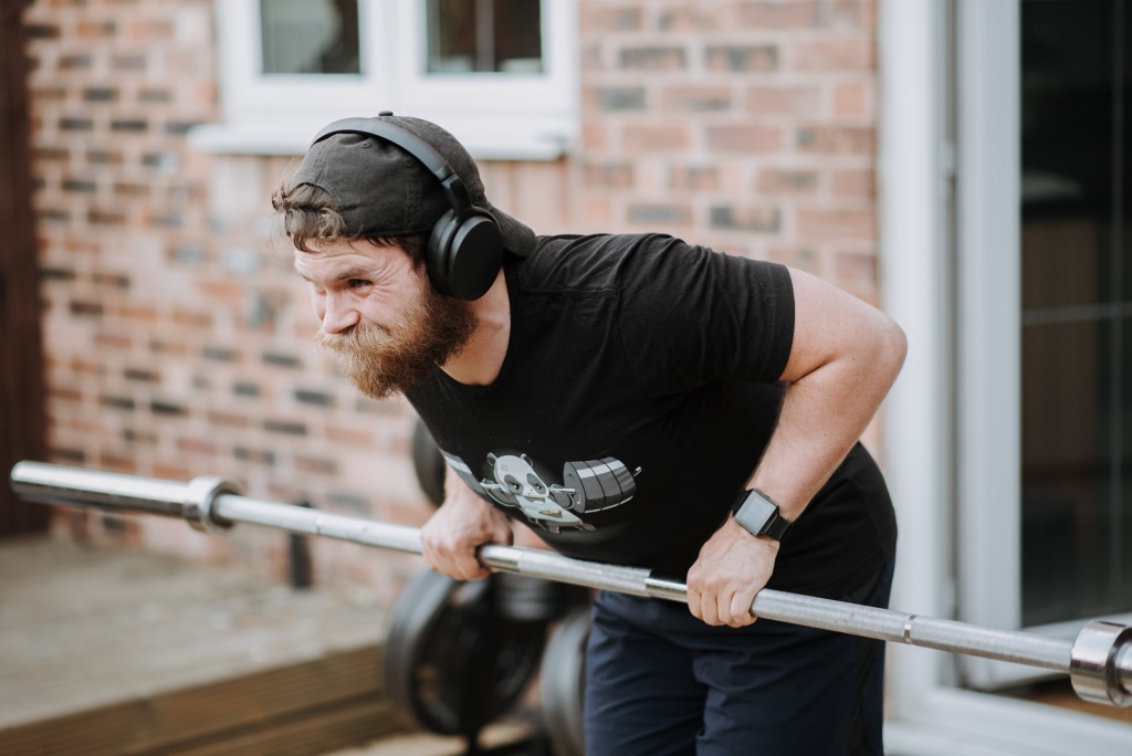A man exercising with headphones