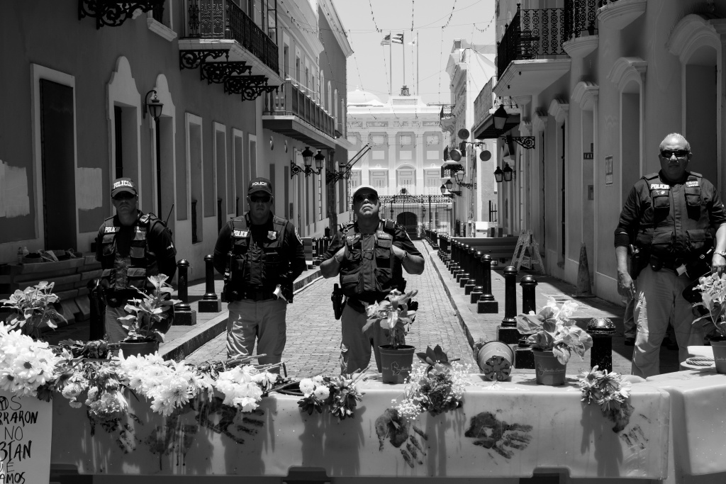 Soldiers with weapons at a barricade