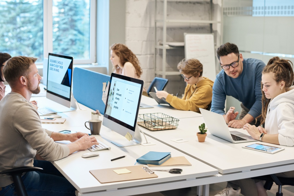 People working in an office with laptops