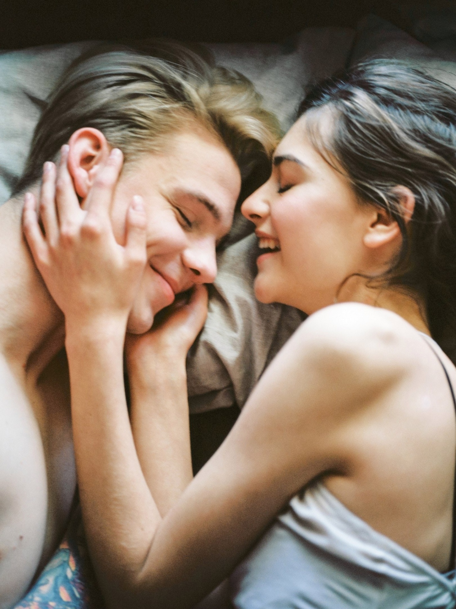 Couple being affectionate in bed